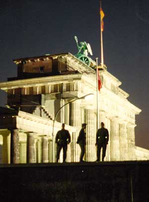 East Germans guards on top of  the Berlin Wall.