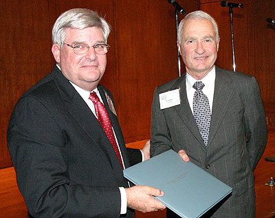 Tom Efird '61, chairman of the GAA's Board of Directors, presents George Lensing with the association's 2007 Faculty Service Award. 