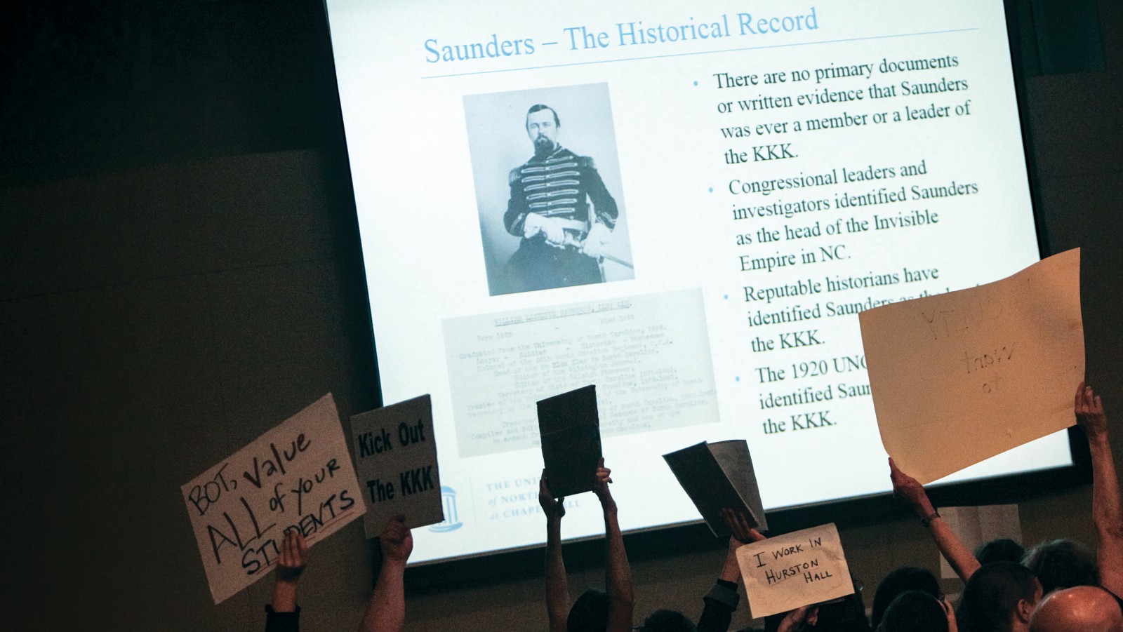 Saunders protest at trustees meeting