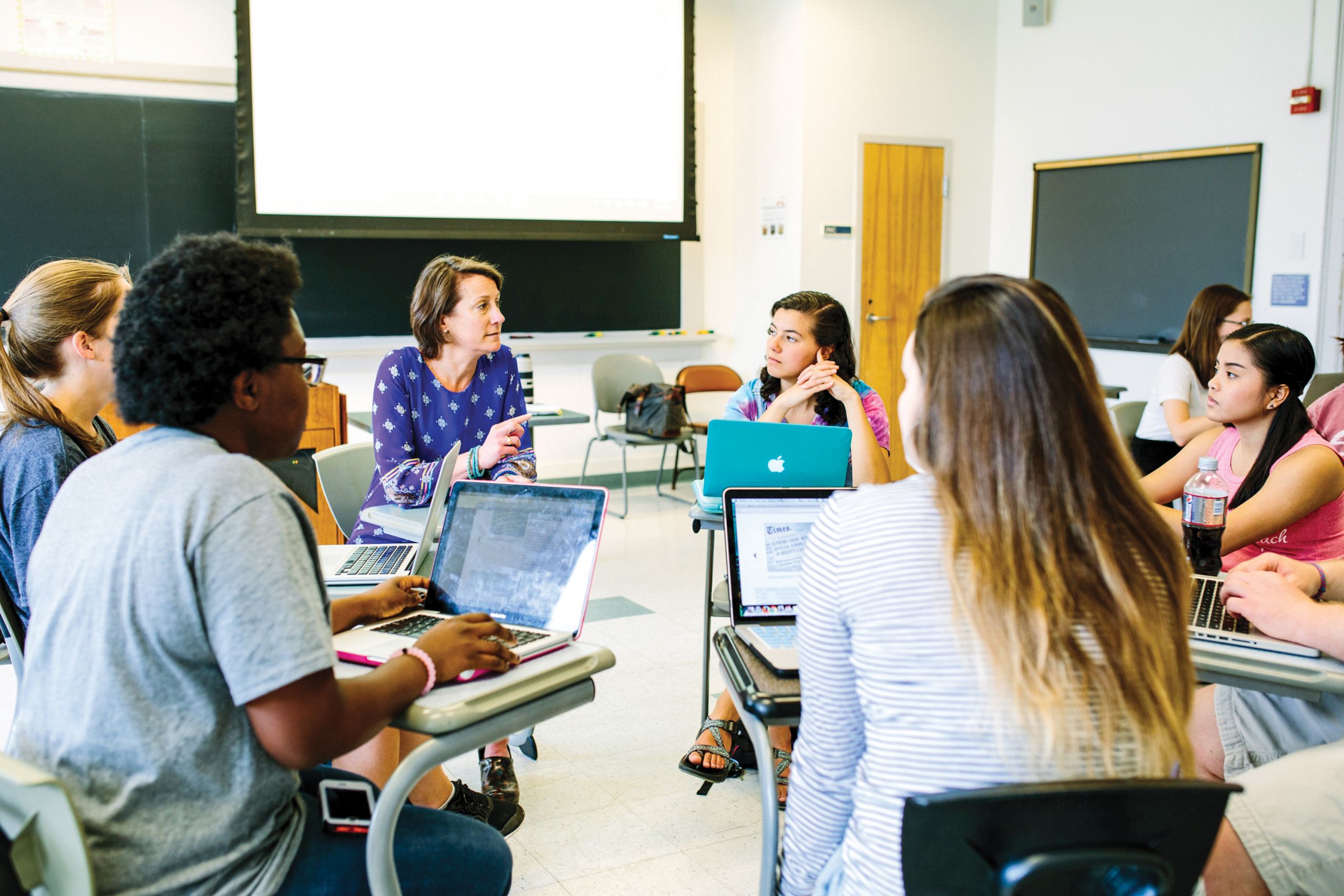 Assistant Professor Cheryl Bolick works with students
