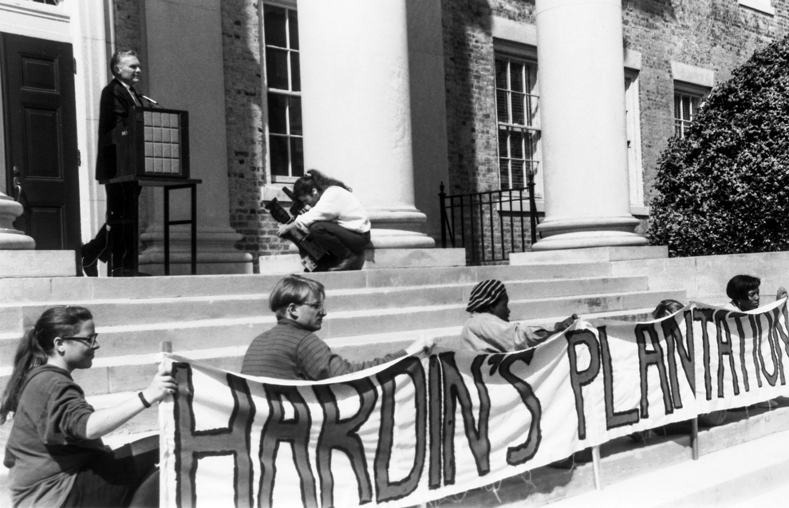 News cameras ably captured placards that read ‘Hardin’s Plantation’ but not the truth that Hardin felt inside — that he was in a lose-lose situation. (Yackety Yack 1993)